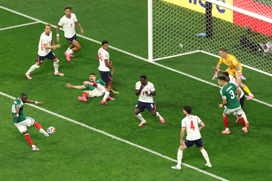Julian Quinones fires the ball into the top of the net for Mexico against England
