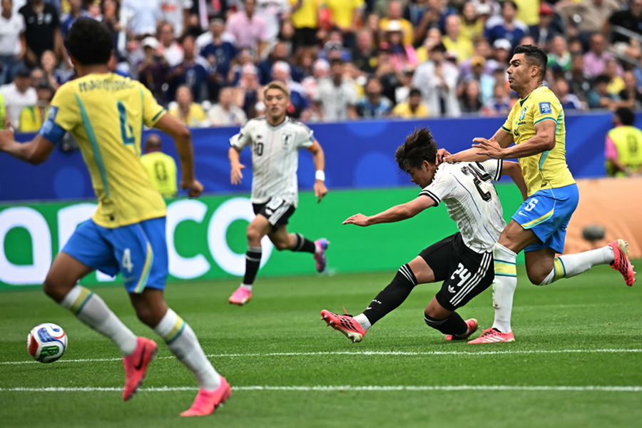 Kaishu Sano shoots and scores for Japan against Brazil