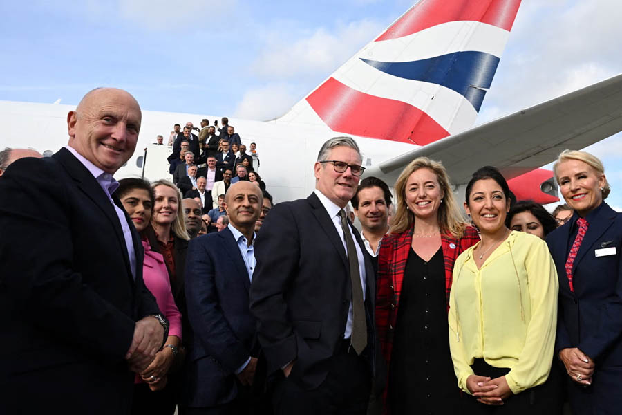 Keir Starmer with UK business delegation at London Heathrow Airport before India trade visit 2025.
