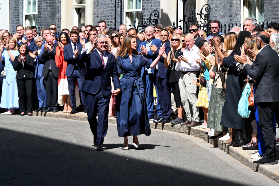 Keir Starmer leaving Downing Street with his wife Victoria after his speech.