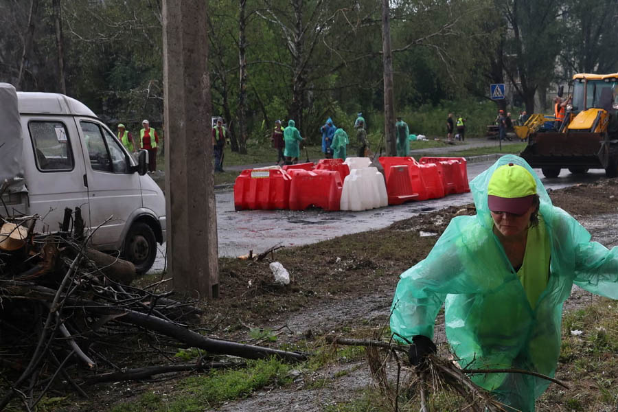 Ukrainians remove rubble after a Russian missile strike hit a sports complex in Kharkiv’s residential district on July 26.