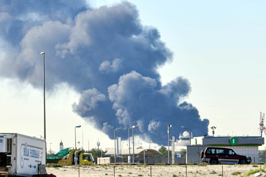 Smoke rises after an Iranian drone attack struck fuel tanks at Kuwait International Airport, triggering a large fire and raising regional security concerns.