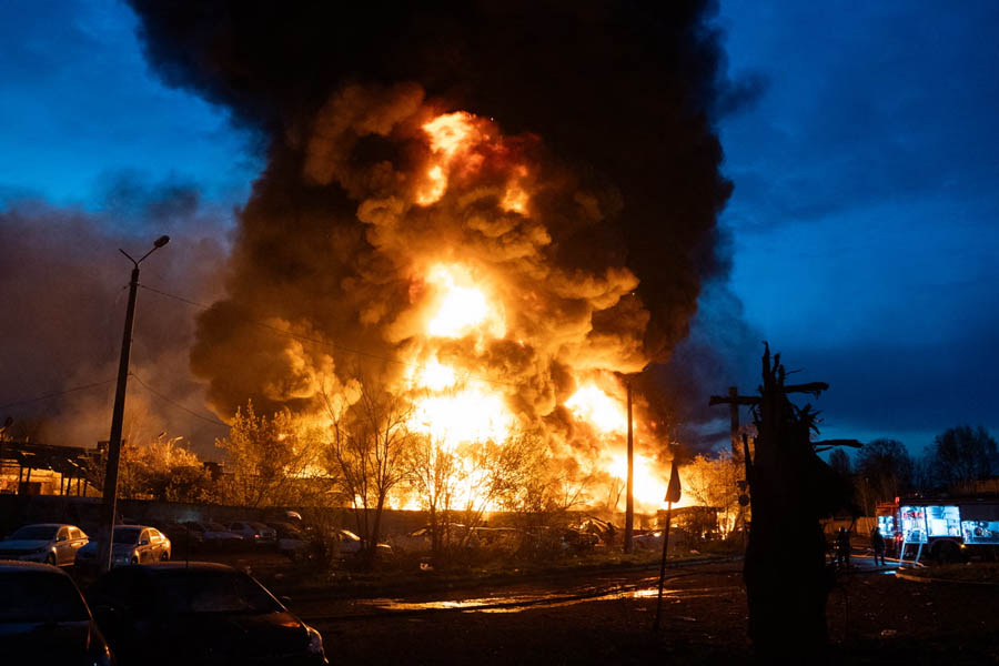 A fire burns at a recycling site in Kyiv after overnight Russian strikes on 16 April.