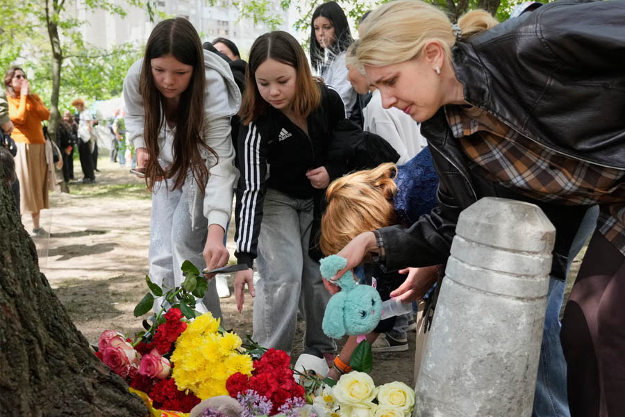 Mourners laying flowers in Kyiv