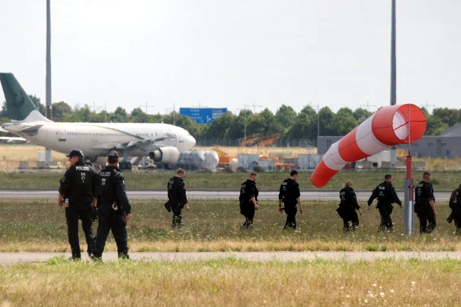Police officers searching for evidence at Leipzig/Halle airport in August.