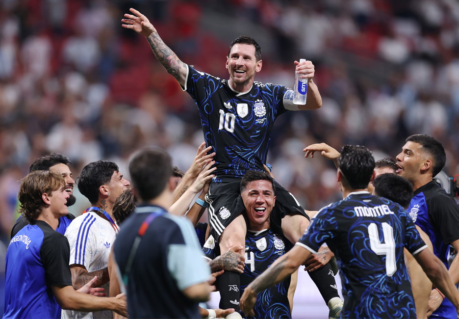 Lionel Messi is hoisted aloft by his teammates after Argentina's stunning comeback victory over England in the World Cup semi-final.