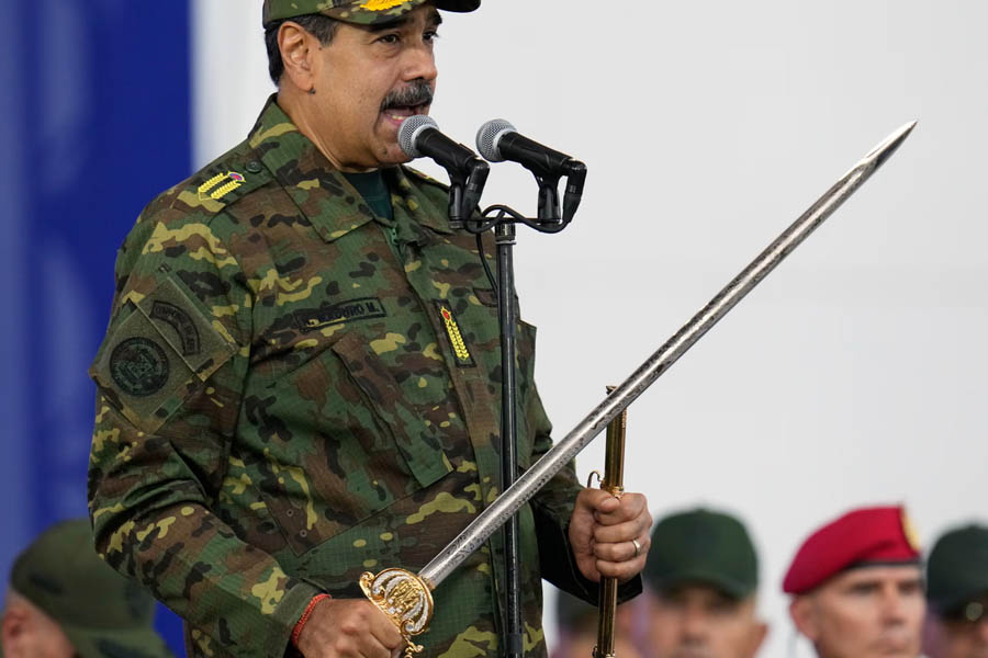 Nicolás Maduro holding Simón Bolívar’s ceremonial sword during a public event in Caracas.