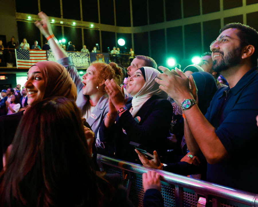 People cheer as results are displayed during Democratic US Senate candidate Abdul El-Sayed's election night event at The Majestic Theatre in Detroit, Michigan, on 4 August