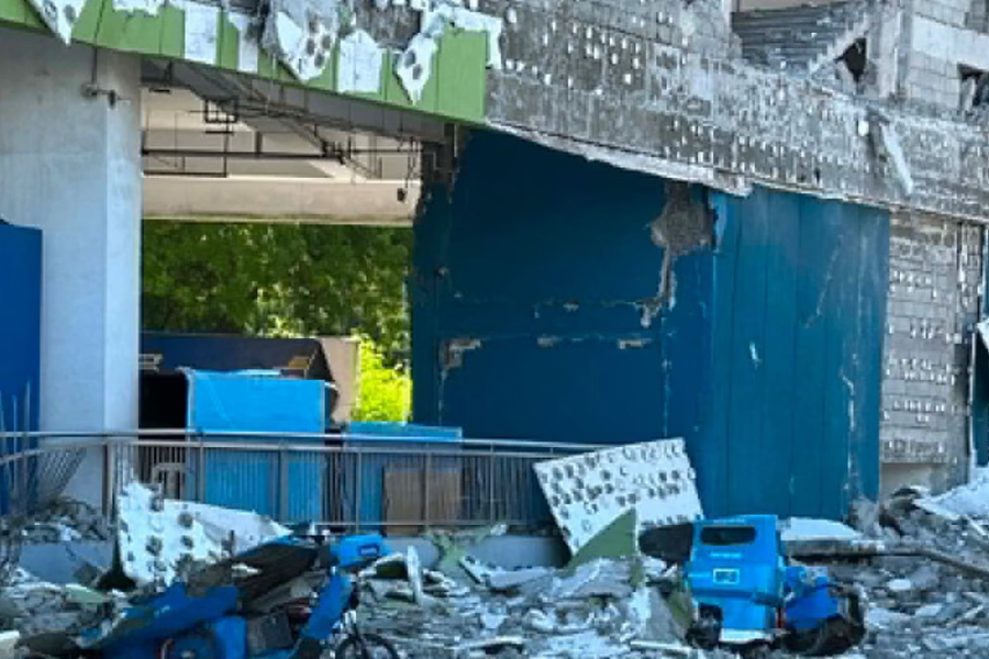 Vehicles crushed and damaged by falling debris from collapsed buildings after earthquake in Mindanao, Philippines