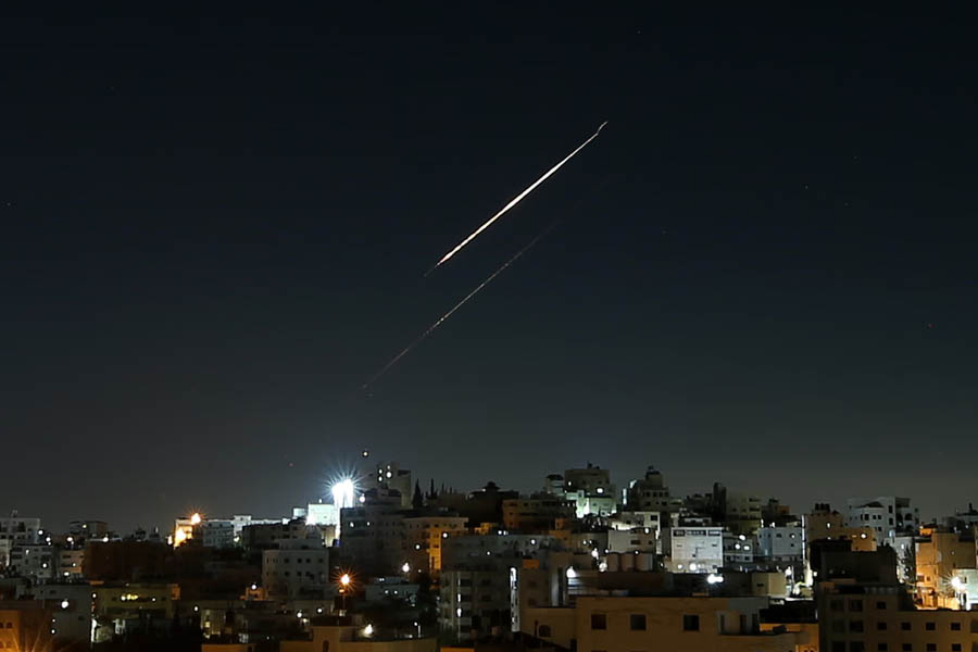 Multiple missiles launched from Iran visible in the sky above Hebron in the West Bank during the Iran–Israel conflict, captured in footage showing trails of smoke against the night sky.