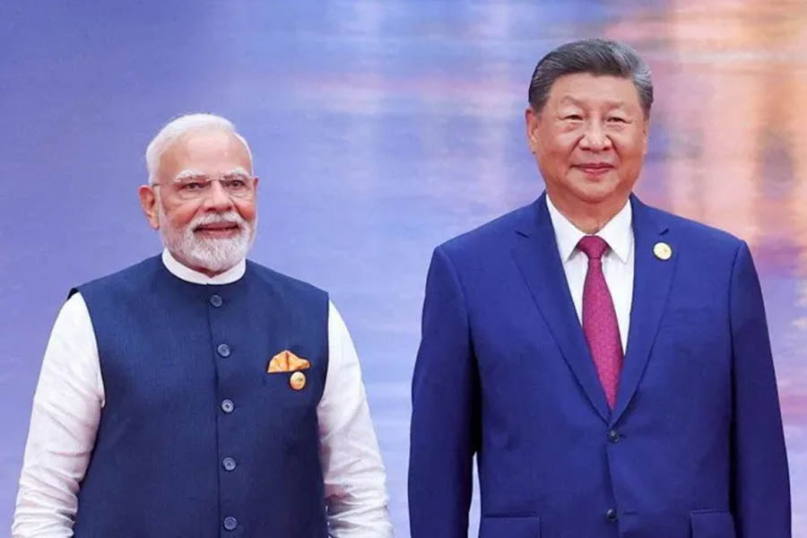 Indian Prime Minister Narendra Modi and Chinese President Xi Jinping posing for photographs in Tianjin during their bilateral meeting on Monday