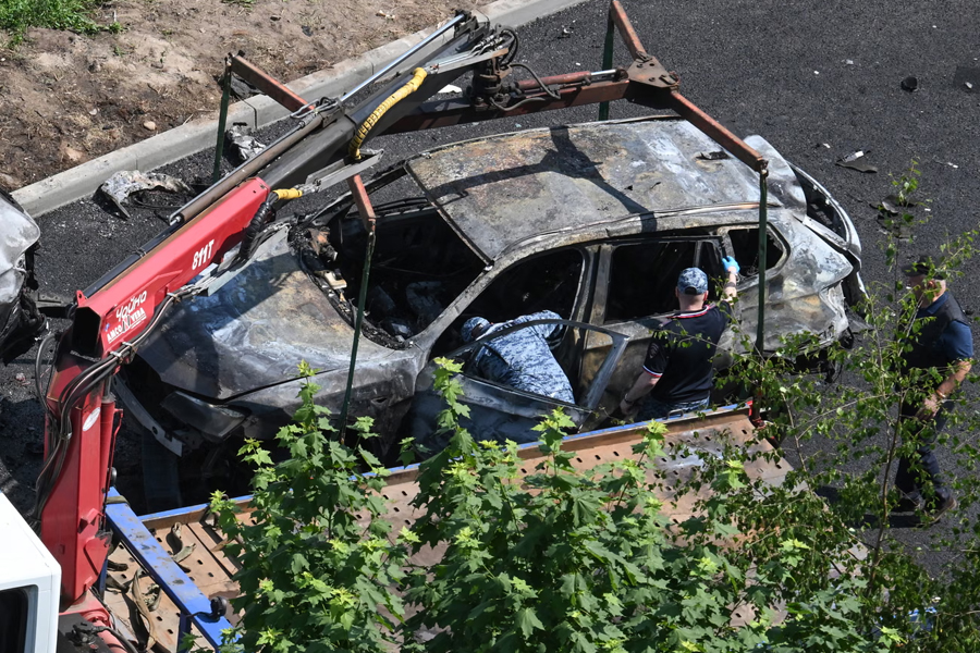Investigators work at the site of a car bombing that killed the driver in Balashikha, outside Moscow. The victim was identified as Damir Davydov, head of the Russian defence ministry's missile and artillery wing.