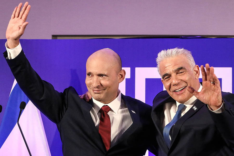 Naftali Bennett (left) and opposition leader Yair Lapid announce their new political alliance, saying it is time to open "a new chapter for Israel" ahead of the upcoming national elections.