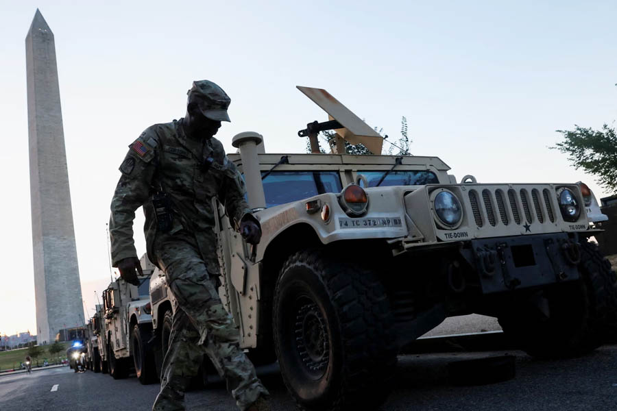 National Guard vehicles stationed near the Washington Monument as troops deploy in the capital following President Trump’s police takeover — a move drawing nationwide condemnation.