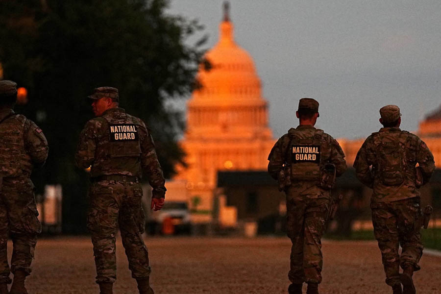 National Guard troops walking down the National Mall in Washington DC, part of the extended deployment to the US capital.