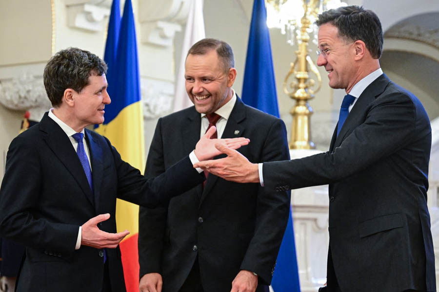 Nato secretary general Mark Rutte, Poland's President Karol Nawrocki and Romania's President Nicușor Dan react during talks at the Cotroceni Palace in Bucharest.