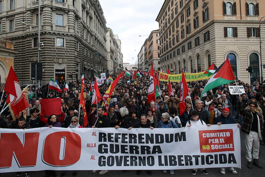 Crowds of No campaign supporters marching in Rome before Italy’s judiciary reform referendum, holding banners and protesting against proposed legal changes