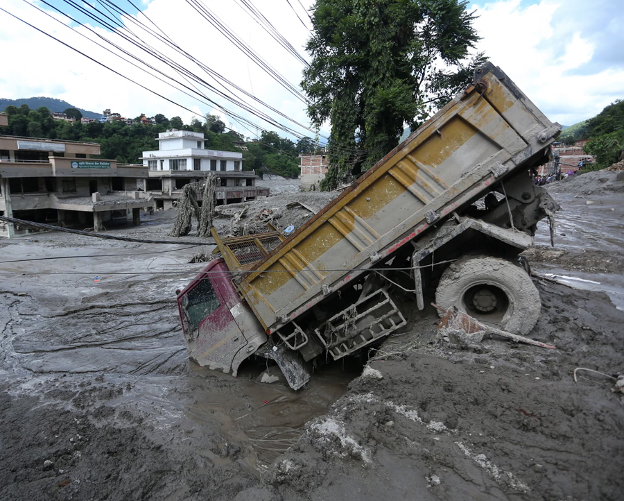A flood-affected area in Nuwakot, Nepal, after outburst of a glacial lake in Tibet. Follow live for latest updates.