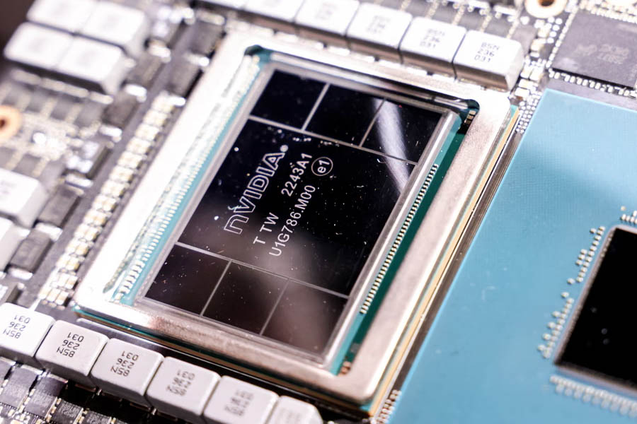 Nvidia headquarters in Silicon Valley with glowing AI chip graphics, symbolizing the company’s record-breaking $5 trillion valuation and leadership in the global AI revolution.