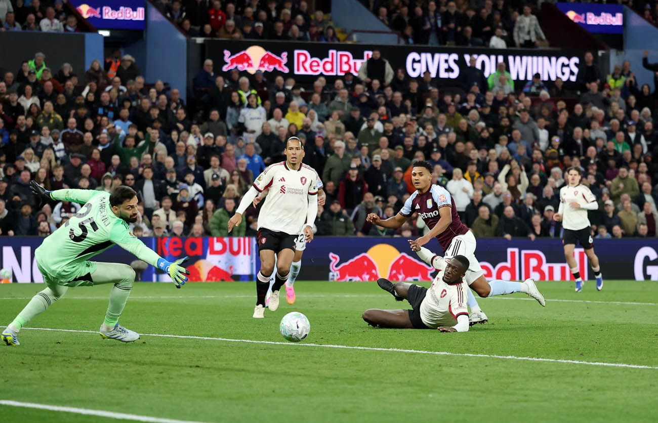Ollie Watkins celebrates after scoring one of his two goals as Aston Villa thrashed Liverpool 4-2 to secure Champions League qualification.