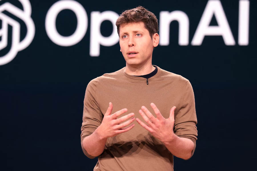 OpenAI CEO Sam Altman with AI data centre servers in the background, illustrating plans for large-scale infrastructure expansion through a potential IPO.