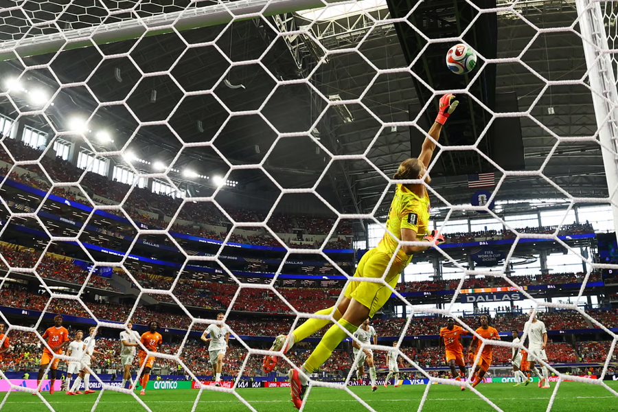 Norway's Ørjan Nyland in action as he makes a save from a free kick from Ivory Coast's Amad Diallo. The goalkeeper's crucial stop in stoppage time preserved Norway's lead.