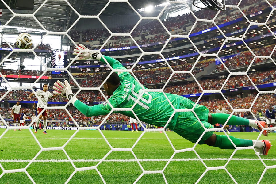 Spain's Mikel Oyarzabal scores their first goal from the penalty spot
