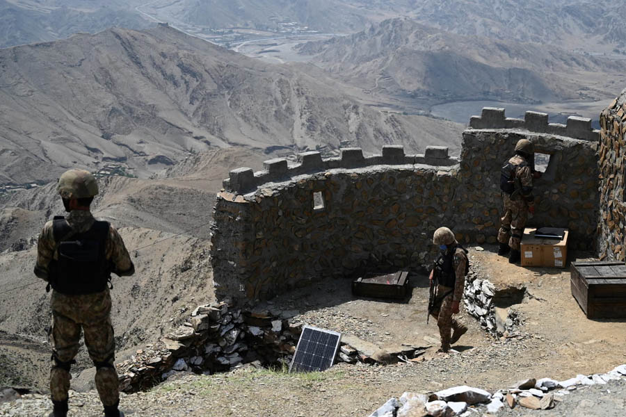 Pakistani soldiers patrolling the mountainous Pakistan-Afghanistan border during heightened military tensions.