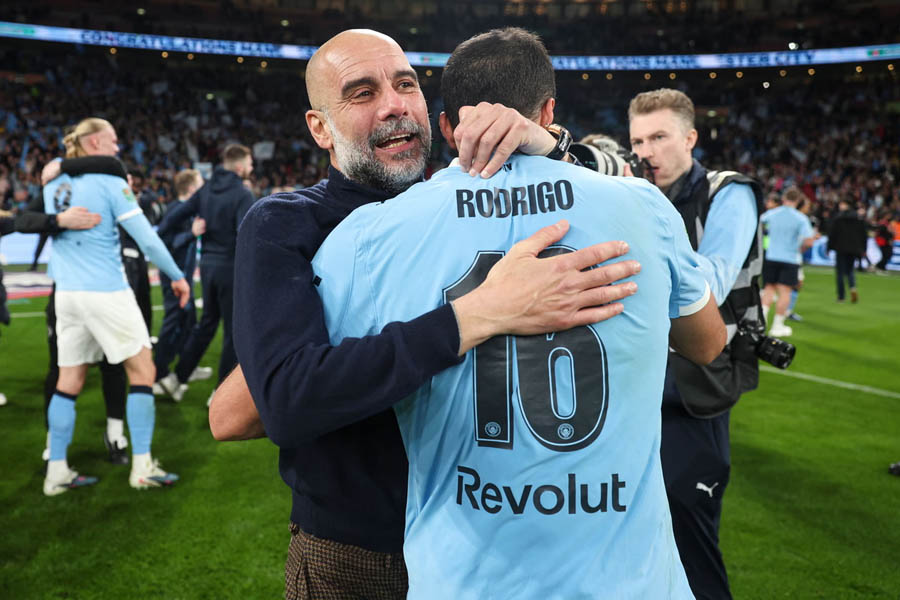 Pep Guardiola and Rodri jubilantly celebrate Manchester City’s Carabao Cup victory at Wembley Stadium.