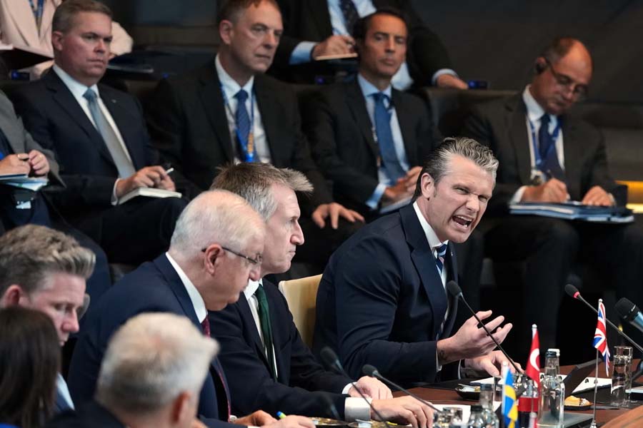US Defence Secretary Pete Hegseth speaks during a press statement at Nato headquarters in Brussels, warning that the "era of free-riding is over" and announcing a six-month review of US forces in Europe.