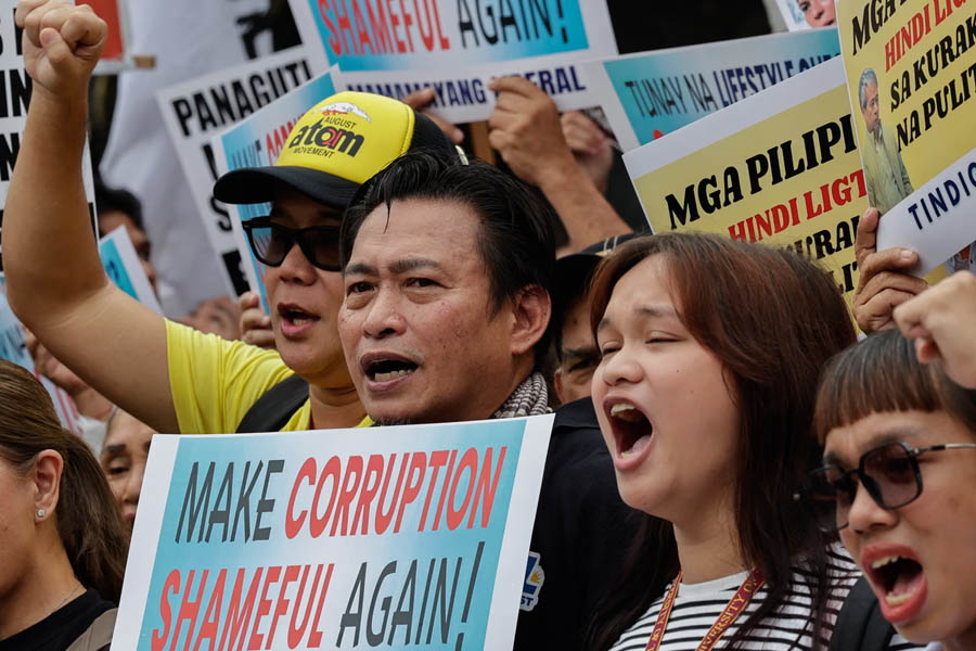 Protesters in Quezon City, Metro Manila, Philippines, hold an anti-corruption rally on 11 September, demanding accountability and reforms in government projects.