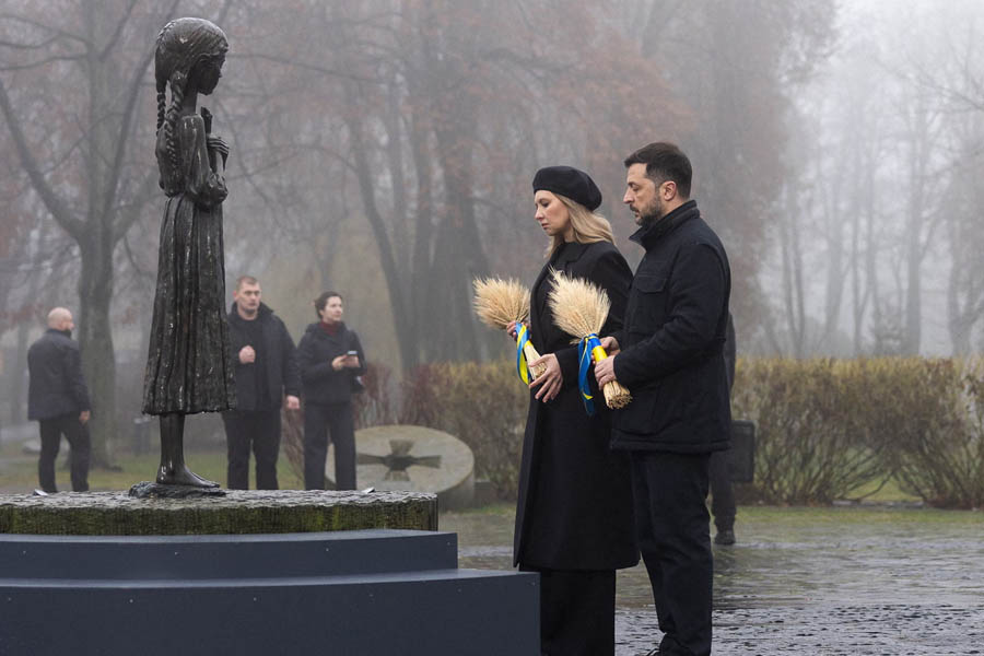 President Zelenskyy and his wife, Olena, standing at the Holodomor memorial in Kyiv, paying tribute to famine victims while addressing concerns over the Trump peace plan.