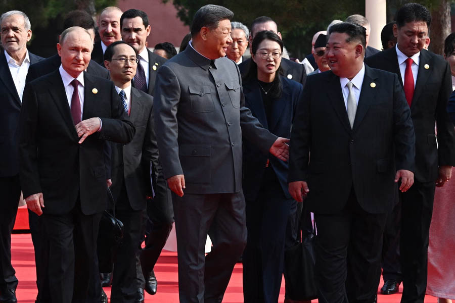 Vladimir Putin walking with Xi Jinping and Kim Jong-un ahead of Beijing military parade commemorating 80th anniversary of victory over Japan.