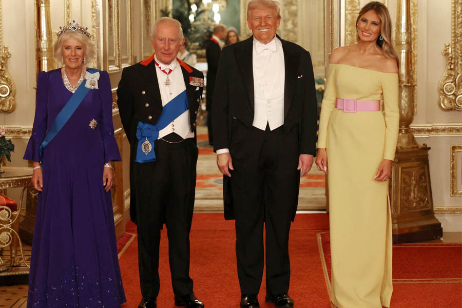 Queen Camilla, King Charles, Donald Trump, and Melania Trump standing together at the Windsor Castle state banquet.