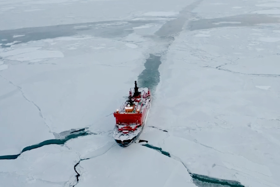Rosatom advertisement showing a nuclear-powered icebreaker convoying an LNG tanker along Russia's Northern Sea Route