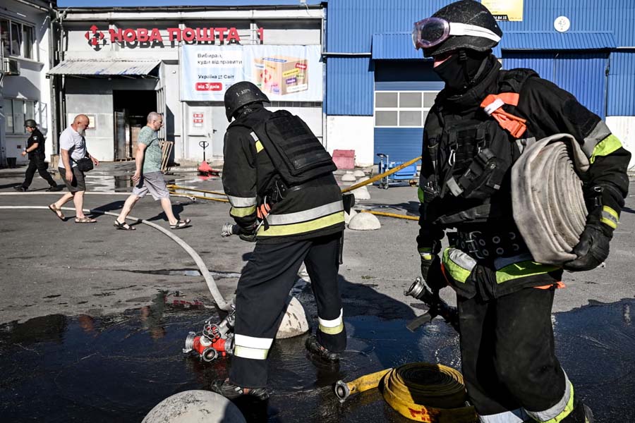 Rescuers at the scene of a Russian drone strike in Zaporizhzhia, Ukraine