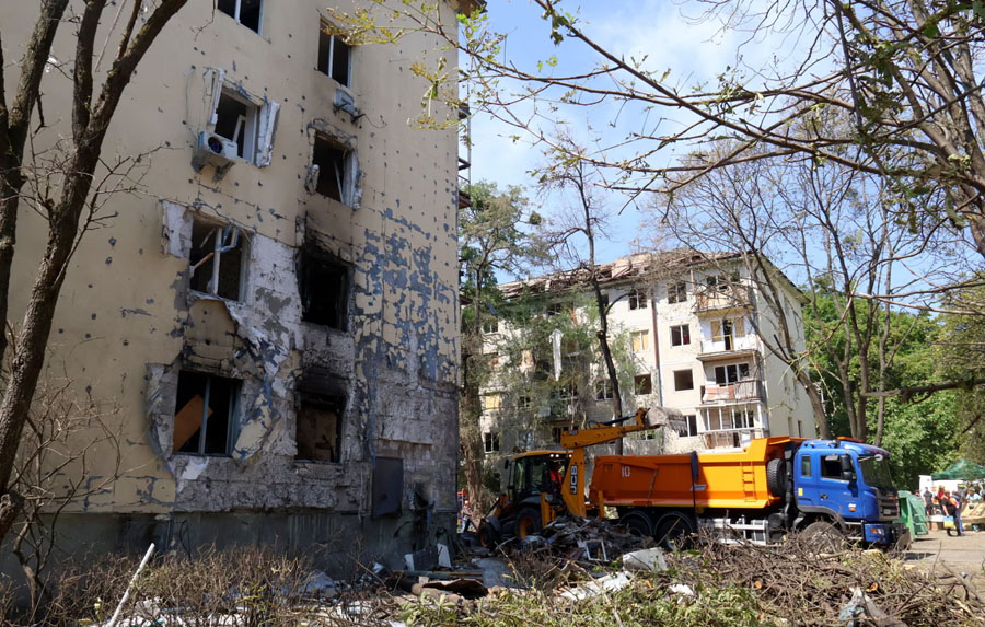 A Russian missile strike partially destroyed an apartment block in Kyiv's Solomianskyi district