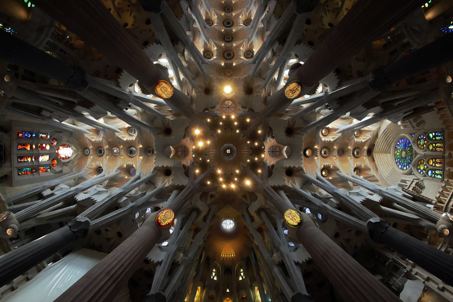 Fisheye lens view of the Sagrada Família basilica interior showing the completed central tower reaching 172.5 metres