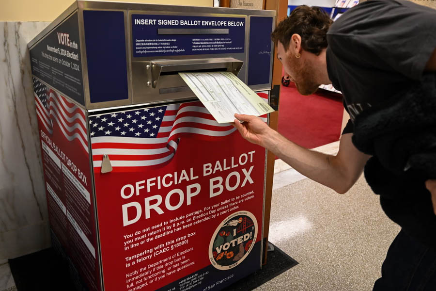 A voter places a ballot into a drop box at San Francisco’s City Hall on November 5, 2024, during the U.S. elections.
