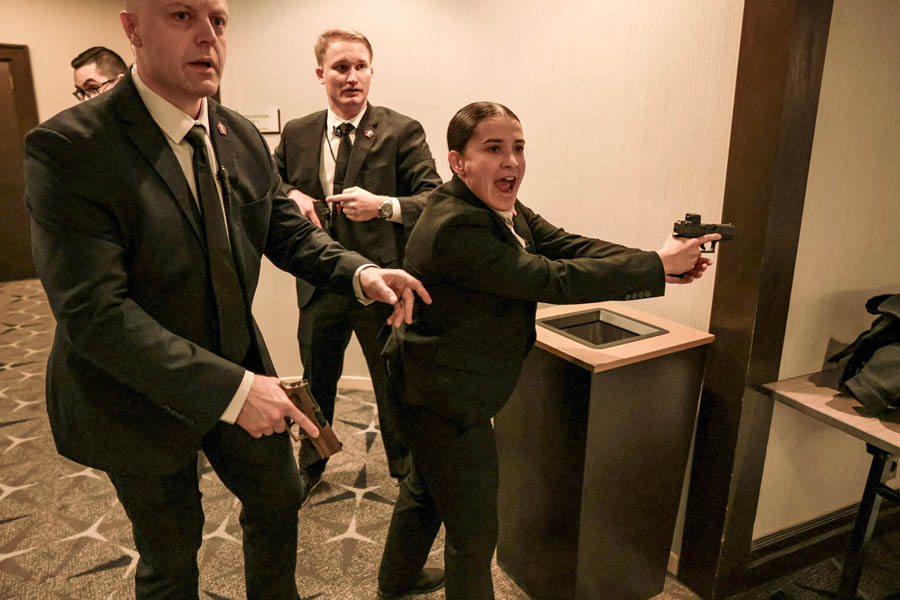 Security officials respond after gunfire erupts at dinner