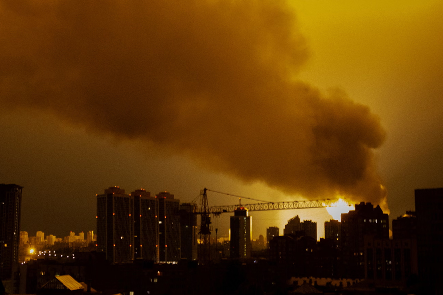 Smoke rises from a fire during the Russian drone and missile attack on Kyiv, with the Dormition Cathedral among the damaged sites.