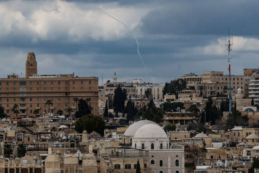 Smoke rising over Jerusalem’s skyline following Iranian retaliatory missile strikes on Israel during heightened Middle East tensions.