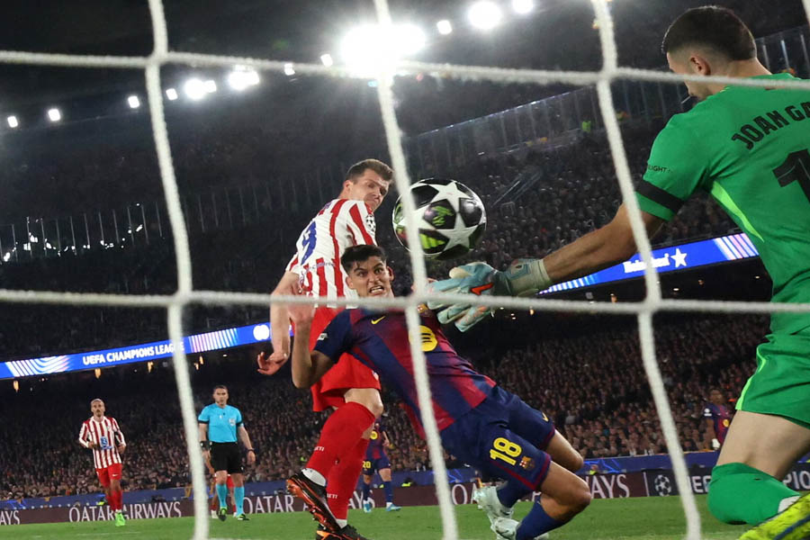 Alexander Sørloth heads past Joan Garcia to double Atlético Madrid's lead.
