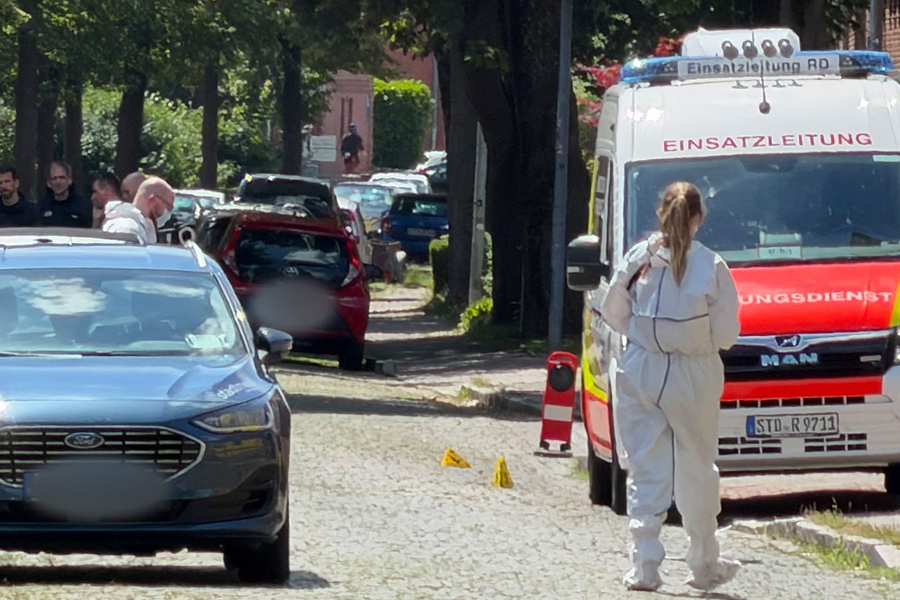 A member of emergency services works at the scene of what police said was a deadly shooting in the town of Stade, Germany, where five people were killed at a youth care facility.