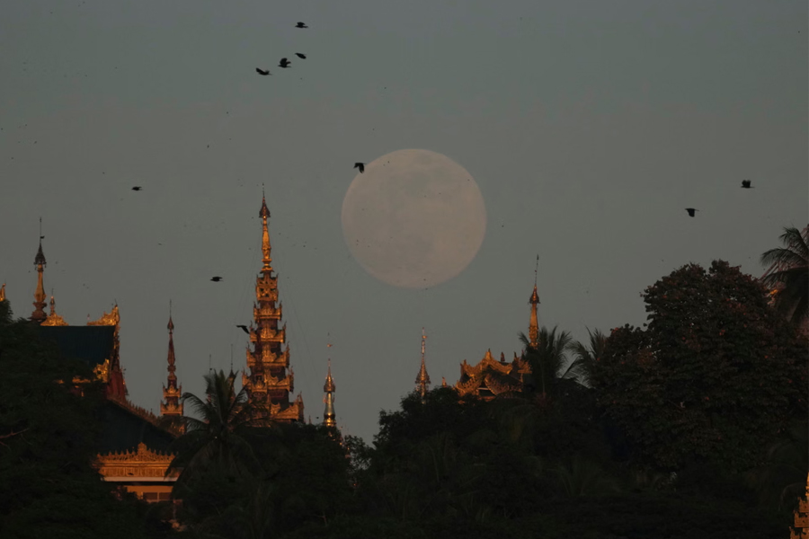 The supermoon rises near the Shwedagon Pagoda in Yangon, Myanmar, during the Tazaungmone full moon lighting festival. The city is now at the center of an investigation into the death of a US diplomat.