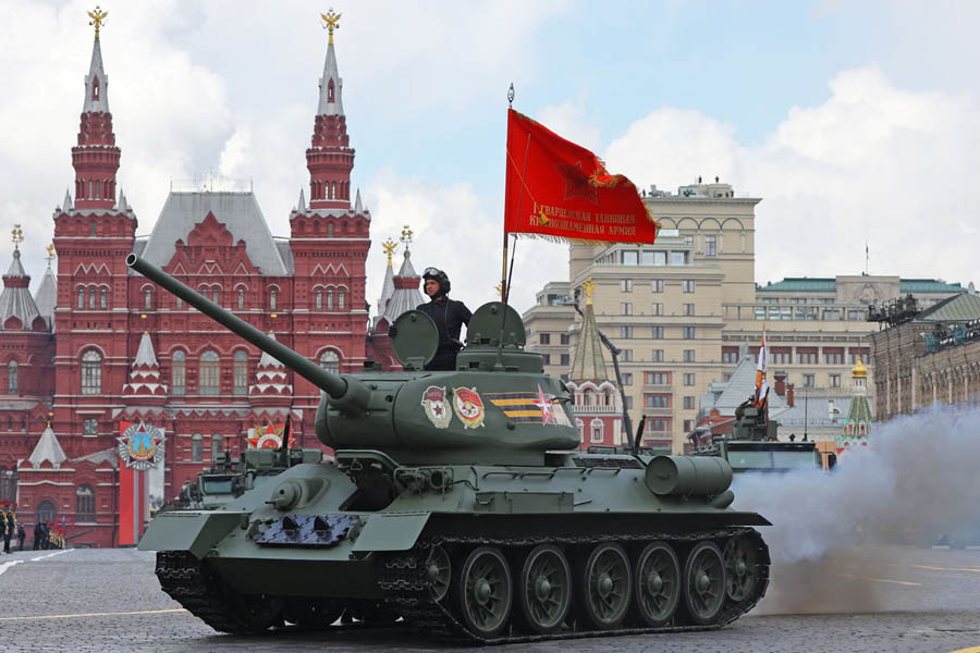 A T-34 Soviet-era tank belches fumes in Red Square during the 2022 Victory Day parade after Russia's full-scale invasion of Ukraine.