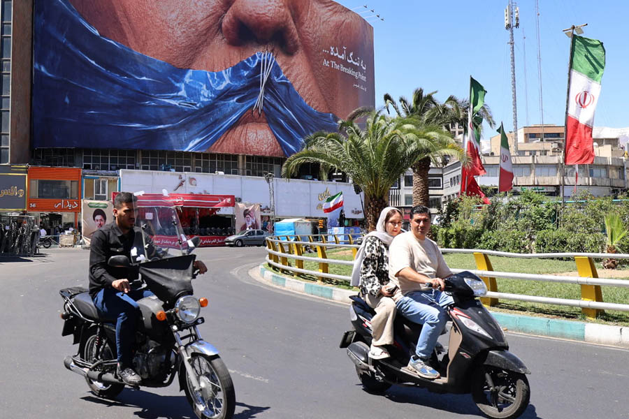Commuters drive past an anti-US billboard referring to president Donald Trump in Tehran on 10 May 2026.