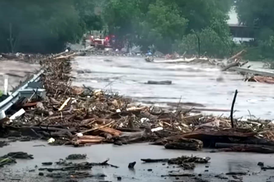 Rescuers search submerged areas near Camp Mystic, Texas, after deadly flash floods swept through the region.