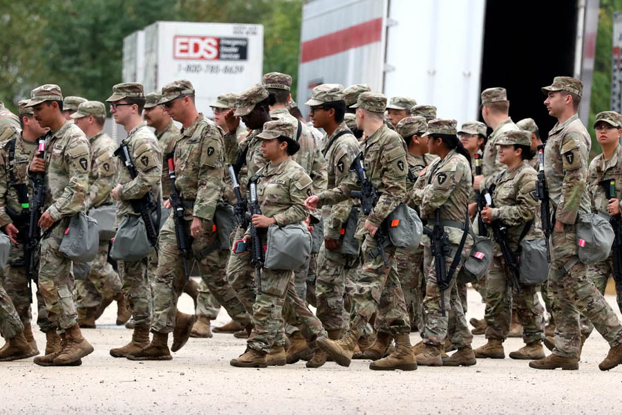 Texas National Guard troops gathered in Elwood, Illinois, during deployment on Tuesday.