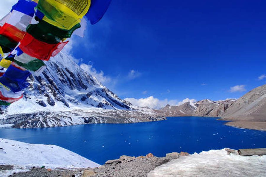 Tilicho Lake in Manang surrounded by snow-capped mountains